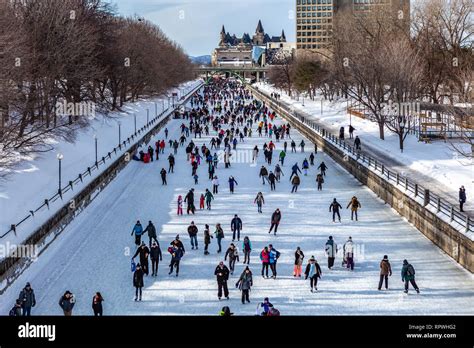 People celebrate the Winterlude festival on the frozen Rideau Canal ...