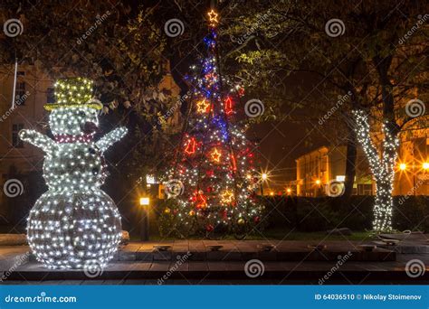 Snowman with Christmas Lights Stock Photo - Image of illuminated, nature: 64036510