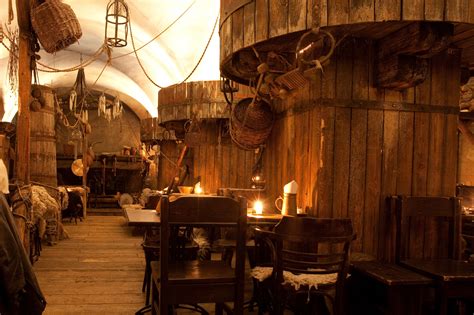 co-mingled seating and brewery design | Medieval, Dark wooden table, Tavern