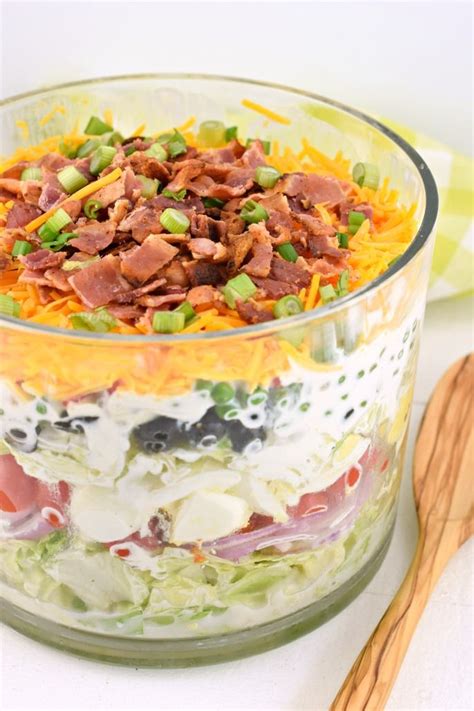 A classic, easy 7 layer Salad recipe served in a trifle bowl. So many options for the seven ...