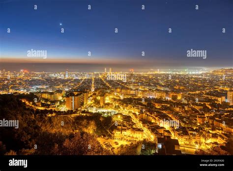 The skyline of Barcelona in Spain at night Stock Photo - Alamy