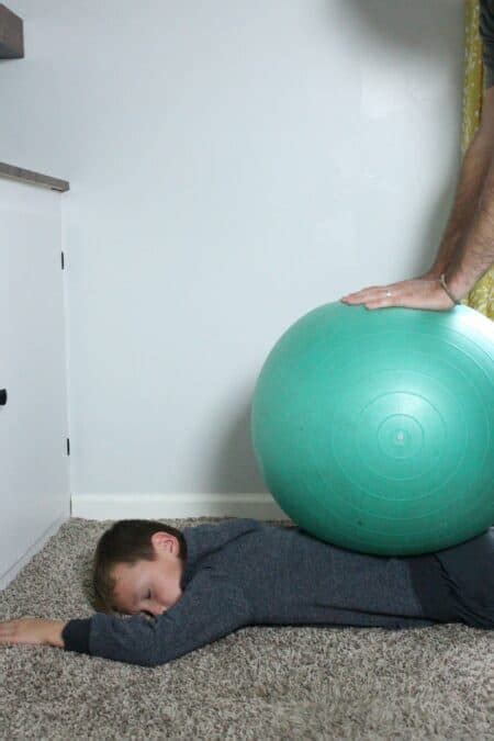 7 Easy Sensory Activities Using a Therapy Ball - Your Kid's Table