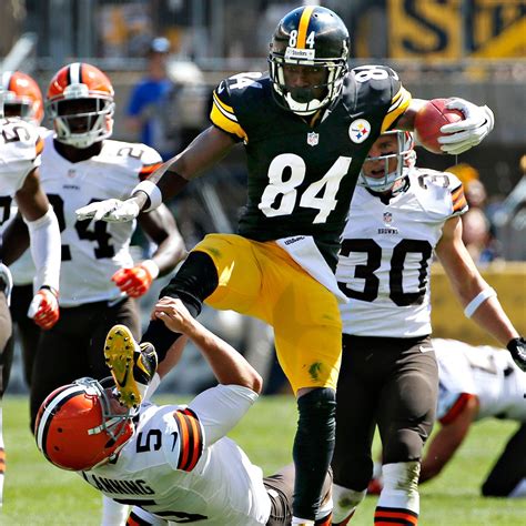 Antonio Brown of Pittsburgh Steelers jump-kicks Cleveland Browns punter ...