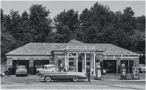 Full-service gas station with garage bays and attendants. Circa 1950s ...