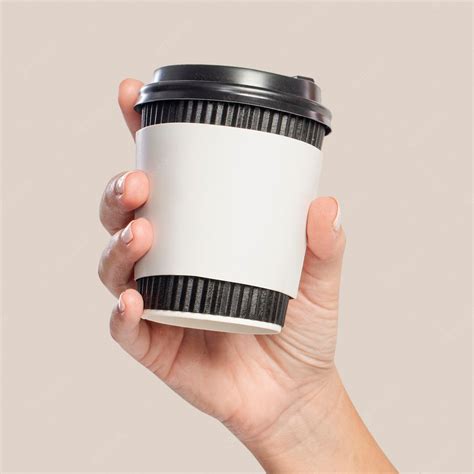 Premium PSD | Coffee cup sleeve mockup psd held by woman's hand