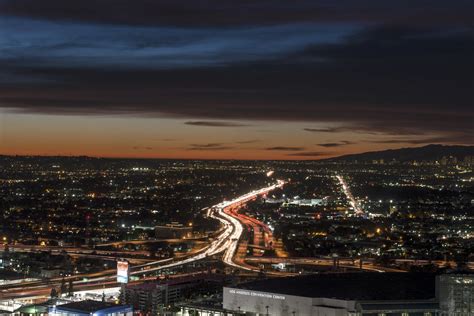 Dusk skyline view of Los Angeles, California, looking west over the ...