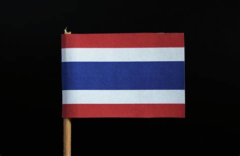 The national flag of the Kingdom of Thailand on toothpick on black ...