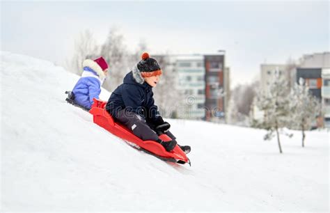 Kids Sliding in Winter Time Stock Image - Image of freeze, cheerful ...