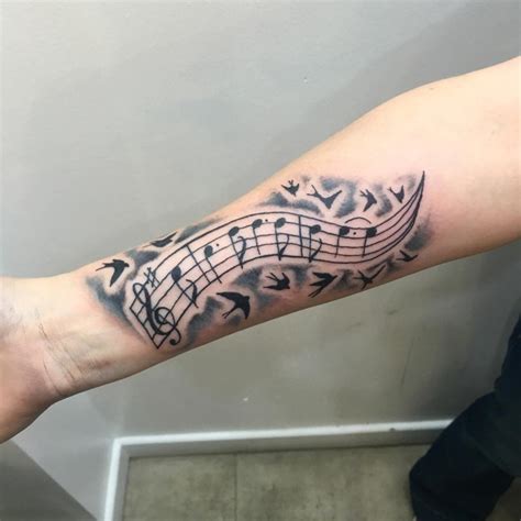 Music Notes Arm Tattoos