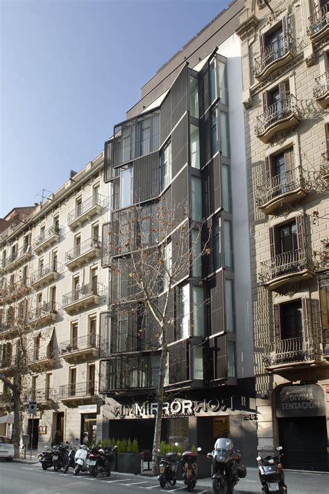 an apartment building on the corner of a street