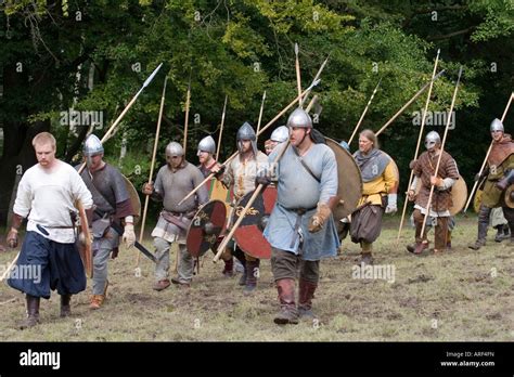 Viking warriors with spears and shields marching into battle at a re-enactment festival Stock ...