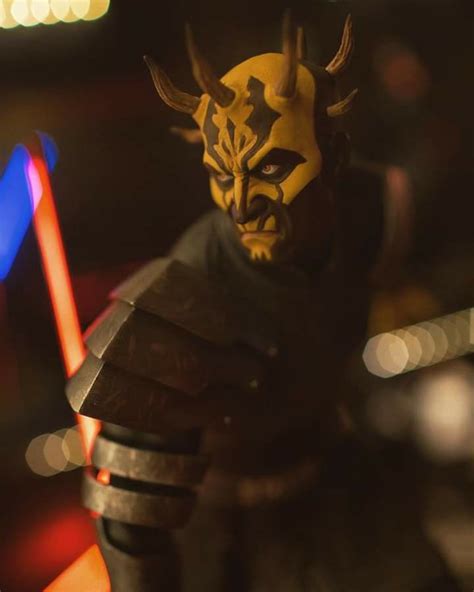 a star wars action figure holding two lights