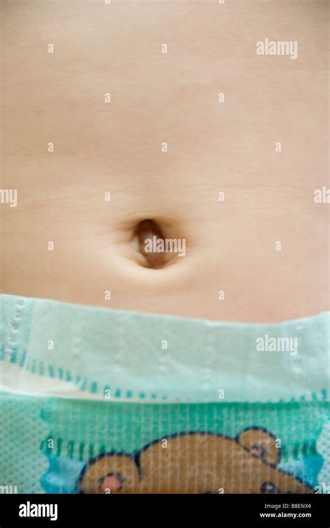 Closeup on belly button and nappy of baby Stock Photo - Alamy