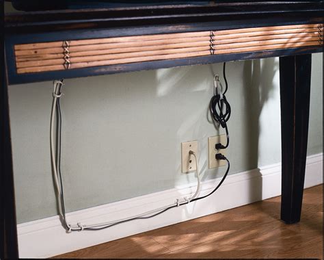 Command™ Brand cord organizers keep the cords from becoming a tangled mess behind your desk ...