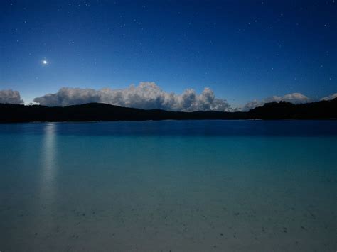 One of dozens of lakes on the island, Lake McKenzie shimmers in the starlight. During the day ...