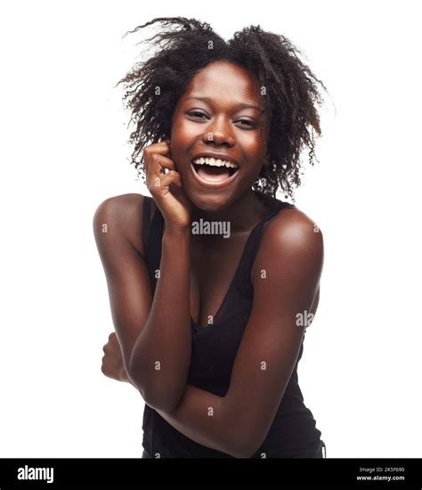 Extreme happiness. Portrait of a beautiful young woman expressing positivity on a white ...