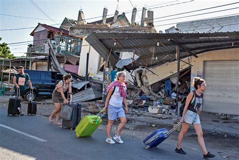 Tourists flee Indonesia's Lombok island after scores killed in massive earthquake - CBS News