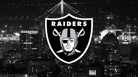 Download Oakland Raiders Logo On City Buildings Wallpaper | Wallpapers.com