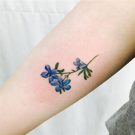 Reasons Why It’s Awesome to Get a Tattoo | Larkspur tattoo, Larkspur flower tattoos, Flower ...