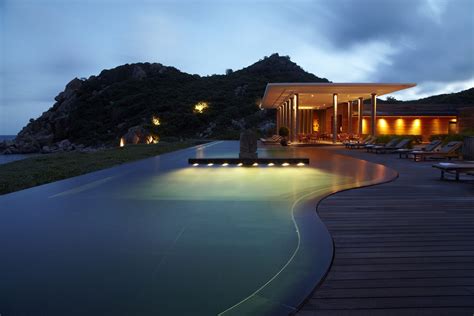 The Amanoi resort infinity swimming pool at dusk - Vinh Hy Bay, VIetnam ...