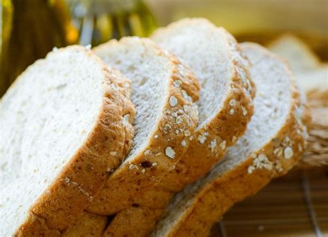 Whole Wheat Bread Slices on Table Stock Photo - Image of oats, healthy: 119535908