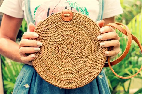 Woman hands with stylich eco friendly rattan bag on a trop… | Flickr