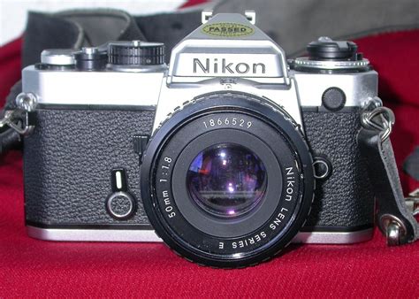 Vintage NIKON FE 35mm SLR Film Camera with 50mm 1.8 lens Nice