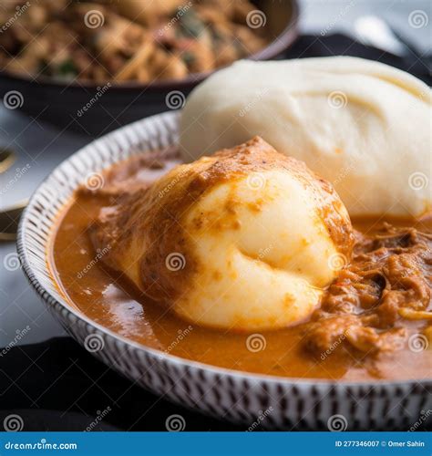 Close-Up Shot of Ghanaian Fufu with Soup and Vegetables Stock ...