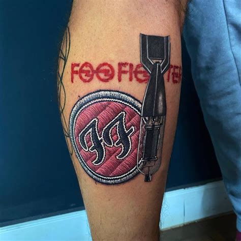 Foo Fighters tattoo done on the calf.