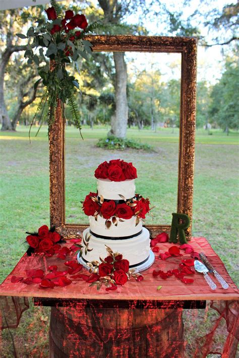 Barrel cake table with gold frame outlining the outdoors. Renaissance wedding | Renaissance ...