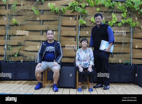 From left, Ho Kai-Shing, Ou xiulan and Pastor Stephen Chan photographed ...