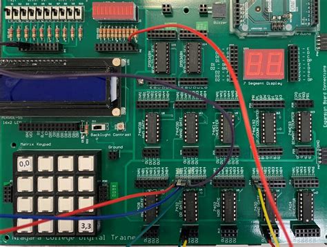 Using the 7400 quad two-input NAND gate IC, draw a logic circuit that will perform the two-input ...