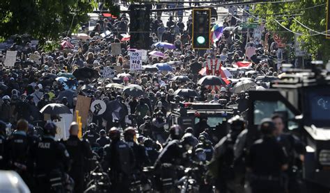 Police declare riot at Seattle protests, make arrests | AP News