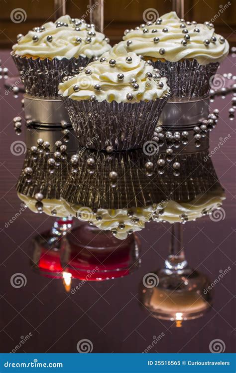 White Cupcakes With Silver Decorative Sprinkles Royalty Free Stock Photo - Image: 25516565