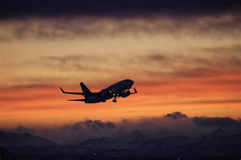 Westjet Boeing 737 sunset takeoff Photograph by James Anderson | Fine ...