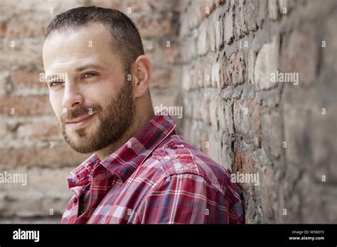 bearded man at the brick wall Stock Photo - Alamy