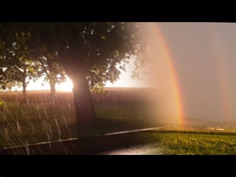 Sun, rain and rainbow - YouTube