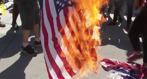 Communist Revolutionaries Set Fire To American Flags In Protest Outside ...