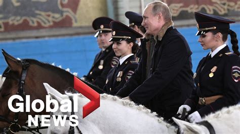 Vladimir Putin rides horse with female police officers ahead of ...