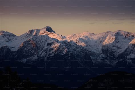 A snowy mountain with a blue sky photo – Mountain Image on Unsplash