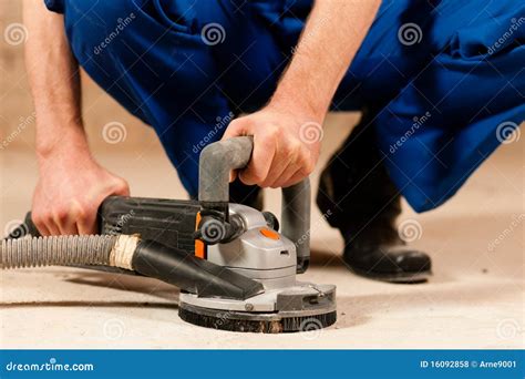 Sanding the cement floor stock photo. Image of sander - 16092858