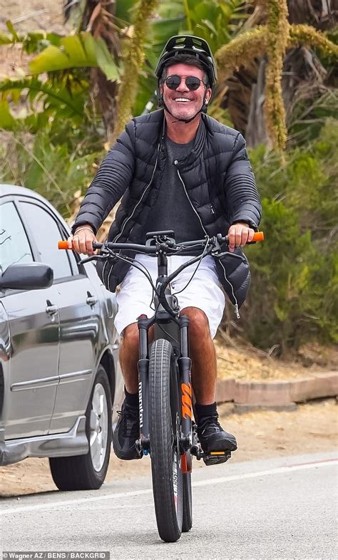 Simon Cowell flashes a smile while taking a cruise around Malibu on his electric bike | Daily ...