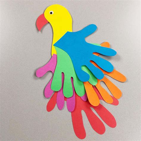 Handprint Parrot - Easy Kids Craft Activity - Emma Owl