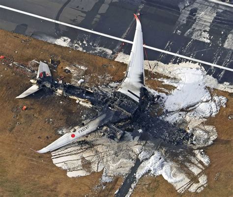 Japan Airlines jet bursts into flames after collision with earthquake relief plane at Tokyo ...