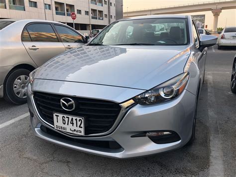 Mazda 3 2017 silver - Overdrive - Rent Cars in the UAE