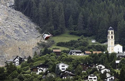 Astonishing photos show huge rockslide that missed Swiss village ‘by a ...