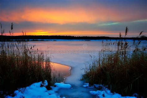 Winter Sunset on a Frozen Lake Stock Photo - Image of wonderland, lake ...