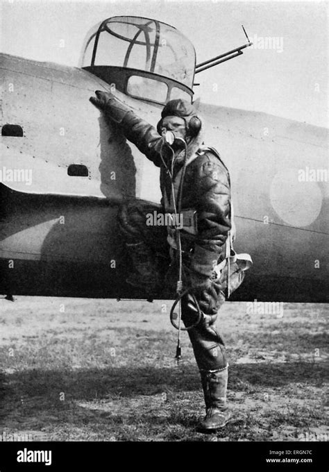 WW2 - Equipment of a British pilot. RAF pilot in full gear next to his plane. Caption reads ...