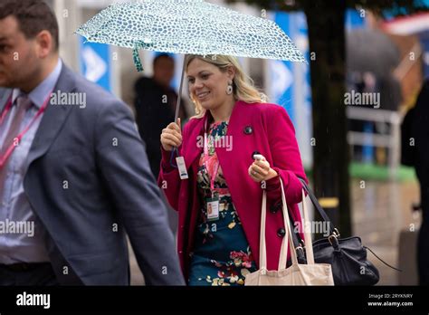 Manchester on Sunday 1st October 2023. Miriam Cates MP shelters from the rain during the ...