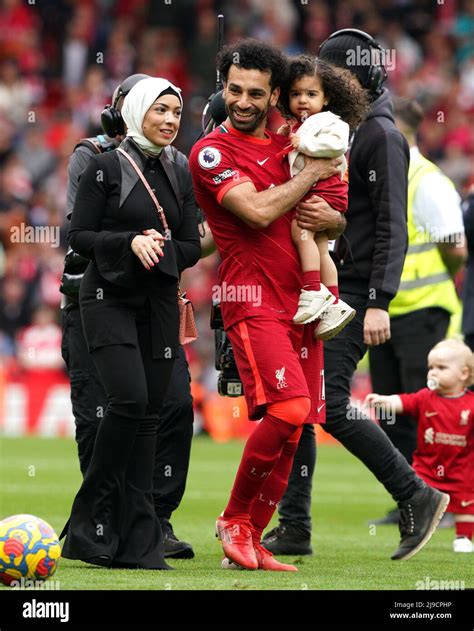 Liverpool's Mohamed Salah walks the pitch with his family after the ...